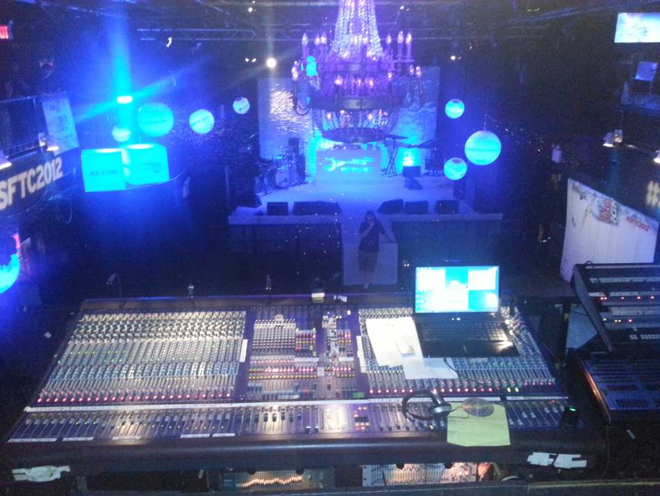 GPR event production console and blue-lit stage